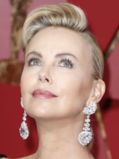 Charlize Theron was dripping in Chopard jewels. The drop earrings featured 59.9 carats worth of diamonds. Paul Buck, EPA